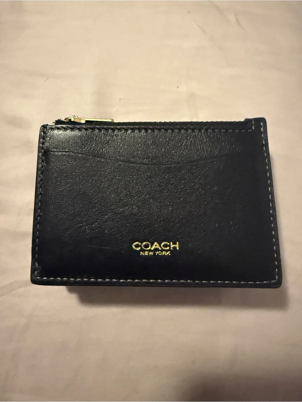 Coach Black Leather Compact Wallet with Gold 'C' Accent